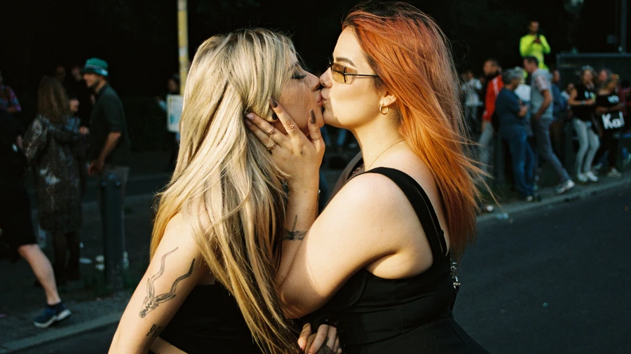 Two raver girls kissing